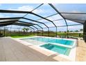 Relaxing pool with a spa and screen enclosure offering picturesque views of the serene surroundings at 15815 Tradewind Ter, Bradenton, FL 34211