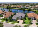 Desirable community home with lake view, mature landscaping, and proximity to neighborhood amenities at 16628 Berwick Ter, Lakewood Ranch, FL 34202