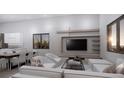 Open-concept living room with modern furniture and integrated kitchen and dining area at 2221 Wood St, Sarasota, FL 34237