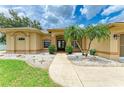 Home entrance featuring double doors, a walkway, and mature palm trees at 23136 Langdon Ave, Port Charlotte, FL 33954