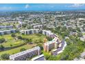 Aerial view of condo complex surrounded by golf courses at 3640 Ironwood Cir # 302N, Bradenton, FL 34209