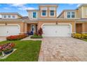 Charming townhome with a brick driveway, freshly cut lawn, and well-kept landscaping at 3673 Fescue Ln, Sarasota, FL 34232