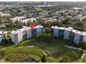 Aerial view of condo building on a green golf course at 3680 Ironwood Cir # 603L, Bradenton, FL 34209