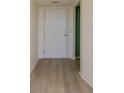 Entryway featuring wood flooring and a white door, offering a clean and bright first impression at 3680 Ironwood Cir # 603L, Bradenton, FL 34209