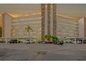 Condo building featuring balconies, covered parking, manicured landscaping, and a stone accent center at 3680 Ironwood Cir # 603L, Bradenton, FL 34209