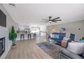 Open floor plan with modern kitchen, light-filled dining area, and a cozy living space at 5032 Barcelona Ave, Sarasota, FL 34235