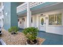 Property doorway showing the address and landscaping in front of the building at 5891 Welcome Rd # I6, Bradenton, FL 34207