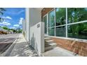 Condo entrance with modern architectural design, steps leading to glass door at 626 Rawls Ave # 626, Sarasota, FL 34236