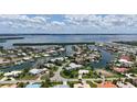 Expansive waterfront home with boat access, showcasing serene views and a luxurious pool in a beautiful community at 670 Old Compass Rd, Longboat Key, FL 34228