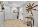 Bright foyer featuring decorative accents, neutral walls, and ceramic tile floors at 7404 14Th W Ave, Bradenton, FL 34209
