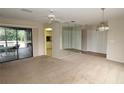 Inviting living room with sliding doors to the deck and an open layout to the kitchen at 753 Tropical Cir, Sarasota, FL 34242