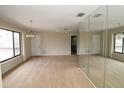 Spacious living room with neutral carpet and large windows for natural light at 753 Tropical Cir, Sarasota, FL 34242