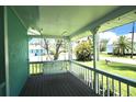 View of a cozy porch with a swing overlooking a picturesque view at 12107 45Th W Ave, Cortez, FL 34215