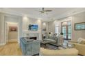 Cozy living room featuring modern furniture, a fireplace, and access to the outside at 1530 Pine Bay Dr, Sarasota, FL 34231