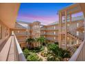 Beautiful courtyard view featuring lush landscaping and manicured grounds at 1613 Gondola Park Dr # 1613, Venice, FL 34292
