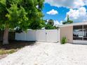 Long driveway with a white fence, leading to the home's entrance at 2416 Emory Ave, Bradenton, FL 34207