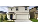 Charming two-story home features a two-car garage, well-maintained lawn, and covered front porch at 2824 Rock Sound St, Bradenton, FL 34208