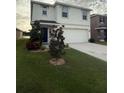 This lovely home boasts a manicured lawn, charming landscaping, and an attached two-car garage at 2824 Rock Sound St, Bradenton, FL 34208