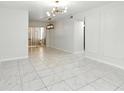 Open-concept room features marble floors, modern lighting, and ample natural light at 4507 9Th W St # J11, Bradenton, FL 34207