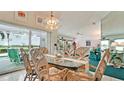 Charming dining area with room for six and sliding glass door leading to the lanai at 5078 47Th W St, Bradenton, FL 34210