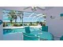 Screened in lanai with pool and lovely water view creates a relaxing outdoor entertainment space at 5078 47Th W St, Bradenton, FL 34210