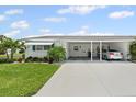 Charming single-story home featuring a covered carport and well-maintained landscaping at 6016 Hibiscus Dr, Bradenton, FL 34207