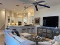 Inviting living room with a modern design, comfortable seating, and an open floor plan to the kitchen at 624 Mourning Dove Dr, Sarasota, FL 34236