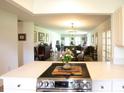 Modern kitchen with stainless steel appliances, stone countertops, and an open layout to living areas at 6504 Heritage Ln # 99, Bradenton, FL 34209