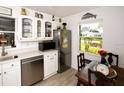 Well-lit kitchen with stainless steel appliances, ample counter space, and a breakfast nook with natural light at 6504 Heritage Ln # 99, Bradenton, FL 34209