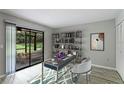 Bright office space with sliding glass doors to the lanai and a modern bookshelf at 814 Spring Lakes Blvd # 14, Bradenton, FL 34210