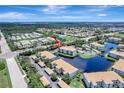 An aerial view capturing the home's location within a charming community with serene water views and lush landscaping at 1000 San Lino Cir # 1034, Venice, FL 34292