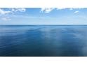 Beautiful ocean view showcasing the vastness of the sea under a bright, partly cloudy sky at 1201 Big Oak Ln, Sarasota, FL 34242