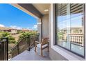 Relaxing balcony view with a rocking chair and an expansive view of neighborhood at 13714 Messina Loop # 202, Bradenton, FL 34211