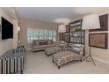Cozy living room features a mix of patterned seating, large lamps, and decorative wall art at 3401 54Th W Dr # 201, Bradenton, FL 34210