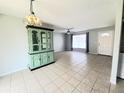 Open concept living area with neutral colors, tile flooring, and natural light at 3526 Southern W Pkwy, Bradenton, FL 34205
