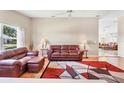Spacious living room with a plush leather sofa set, stylish rug and ample natural light at 4107 Brittany Ln # 18, Sarasota, FL 34233