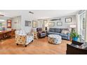 Cozy living room featuring stylish seating, wood floors, and nautical decor for a relaxed ambiance at 6002 34Th W Ave, Bradenton, FL 34209
