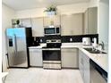 Stylish kitchen featuring stainless appliances, with a clean, modern design at 6253 Whetstone Ct, Palmetto, FL 34221
