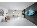 Spacious basement featuring recreation area, bike rack, and modern finishes at 9990 Key Haven Rd, Seminole, FL 33777