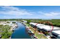 Waterfront condo boasts lush landscaping and a boat lift, perfectly situated near scenic waterways at 10311 Waterbird Way, Bradenton, FL 34209