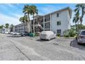 Multi-story condo building with palm trees and parking lot at 2014 Canal Dr # M6, Bradenton, FL 34207