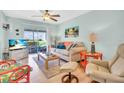 Bright living room with sliding glass doors leading to outdoor space at 2014 Canal Dr # M6, Bradenton, FL 34207