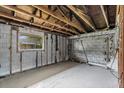 Interior space of a building showcasing concrete block walls and wooden framing at 268 Alsace Ave, Venice, FL 34293