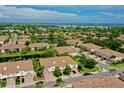 Expansive aerial view of a community with lush landscaping, serene lakes, and beautiful homes in a desirable area at 4026 Overture Cir # 487, Bradenton, FL 34209