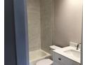 Modern bathroom featuring tub with white tile and contemporary vanity at 5178 Lake Village Drive # 86, Sarasota, FL 34235