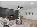 Cozy living room featuring a striking black stone fireplace and stylish decor at 5718 Magnolia N St, St Petersburg, FL 33703