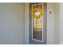 Close-up of a front door with decorative wreath and security features at 8755 Dolomite Ave, North Port, FL 34287