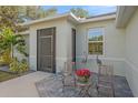 Inviting front porch with seating and decorative accents, perfect for relaxing at 8755 Dolomite Ave, North Port, FL 34287