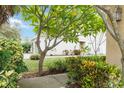 A verdant front yard boasting colorful landscaping, adding to the property's curb appeal at 2303 28Th E Ave, Palmetto, FL 34221