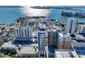 A high-angle view captures buildings, a marina, and waterfront features on a sunny day at 33 S Palm Ave # 1501, Sarasota, FL 34236